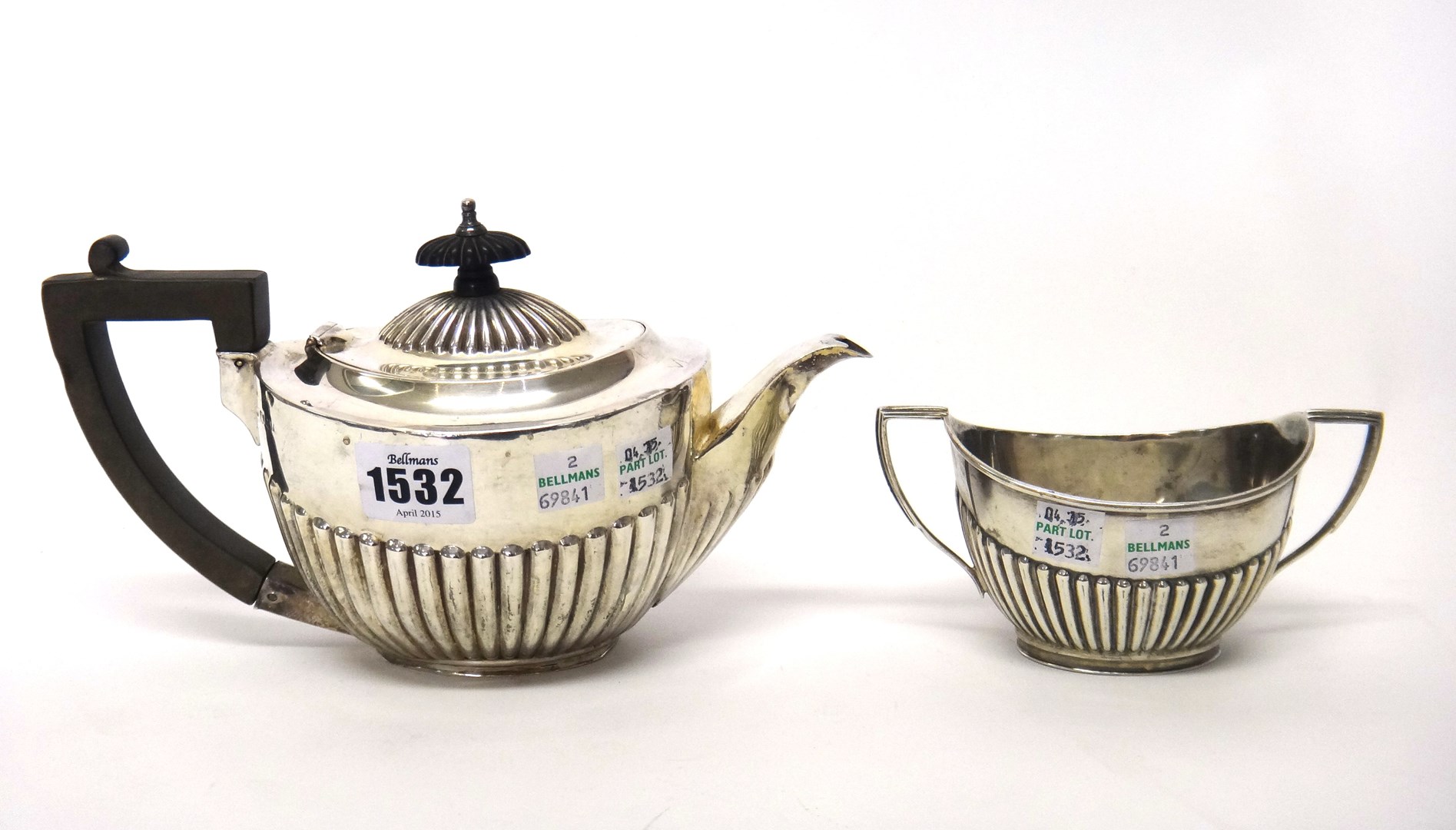 Appraisal: A silver teapot and a matching silver twin handled sugar