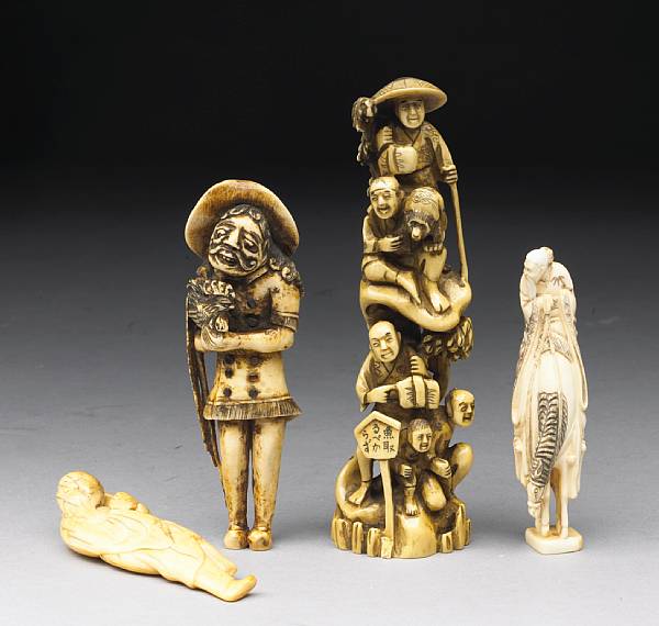 Appraisal: A group of four ivory carvings The first an th