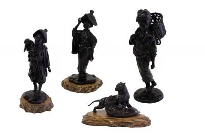 Appraisal: Three Japanese bronze figures Meiji period and a figure group