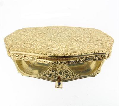 Appraisal: A gold menaudiere The shaped oval box with removing lipstick