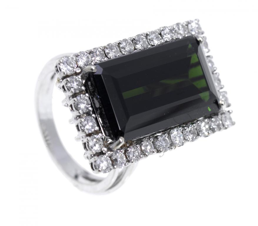 Appraisal: A TOURMALINE AND DIAMOND CLUSTER RING the larger step cut