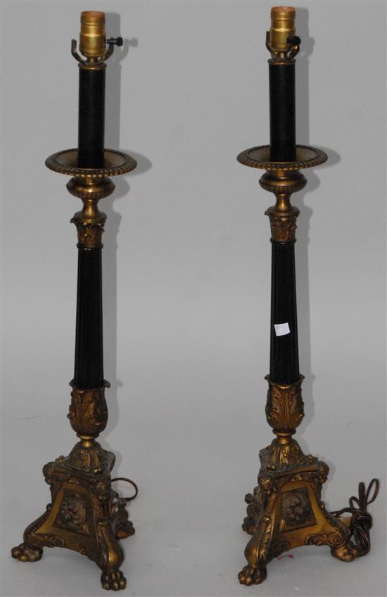 Appraisal: A PAIR OF CLASSICAL STYLE CANDLESTICKS Mounted as lamps with