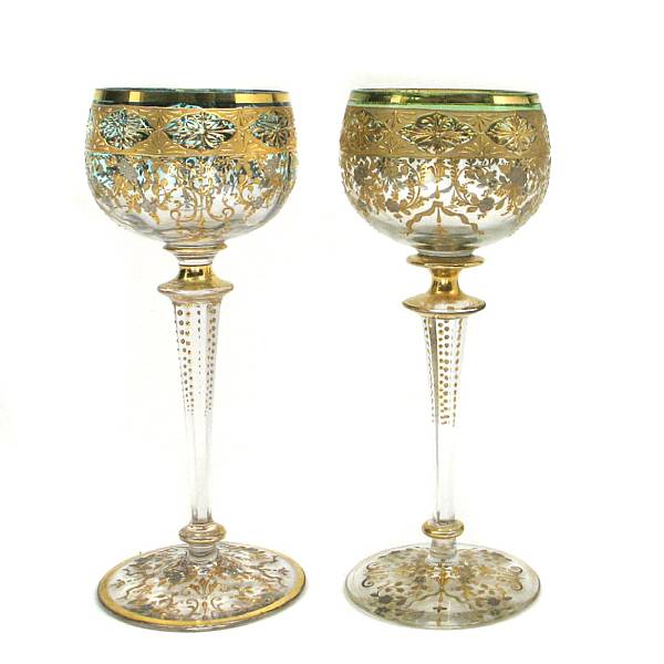 Appraisal: A set of eight Bohemian gilt heightened goblets height in