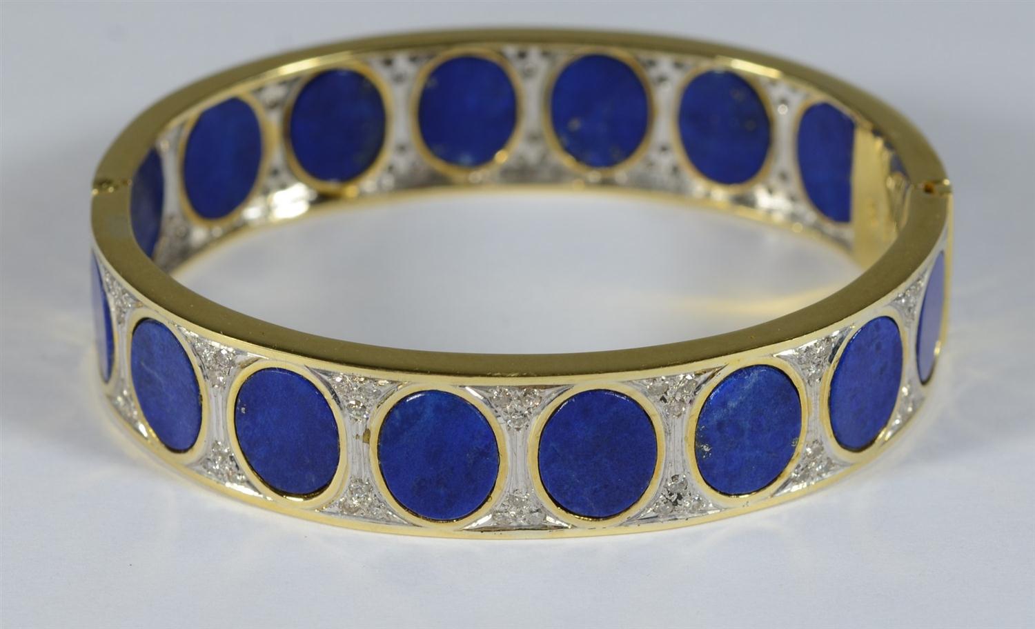 Appraisal: K YG lapis and diamond hinged bangle bracelet diamonds surrounding