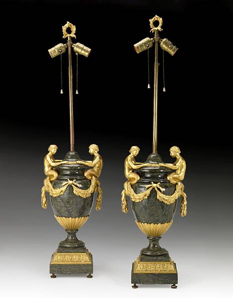 Appraisal: A pair of gilt bronze mounted marble table lamps Each