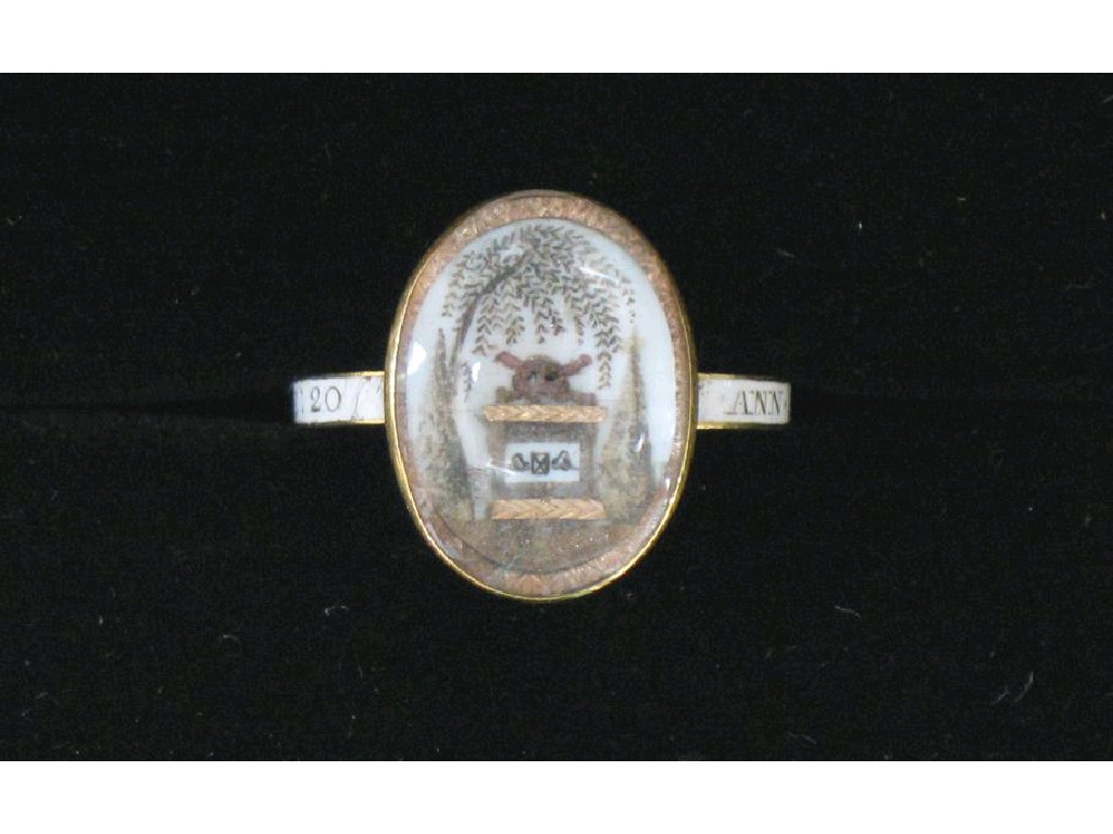 Appraisal: A LATE TH CENTURY MOURNING RING the oval bezel painted