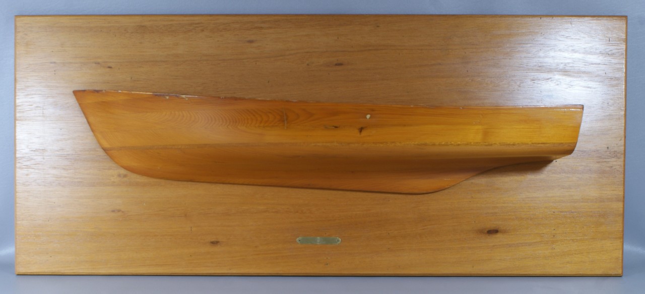 Appraisal: Wooden half hull model of a ship cedar on a