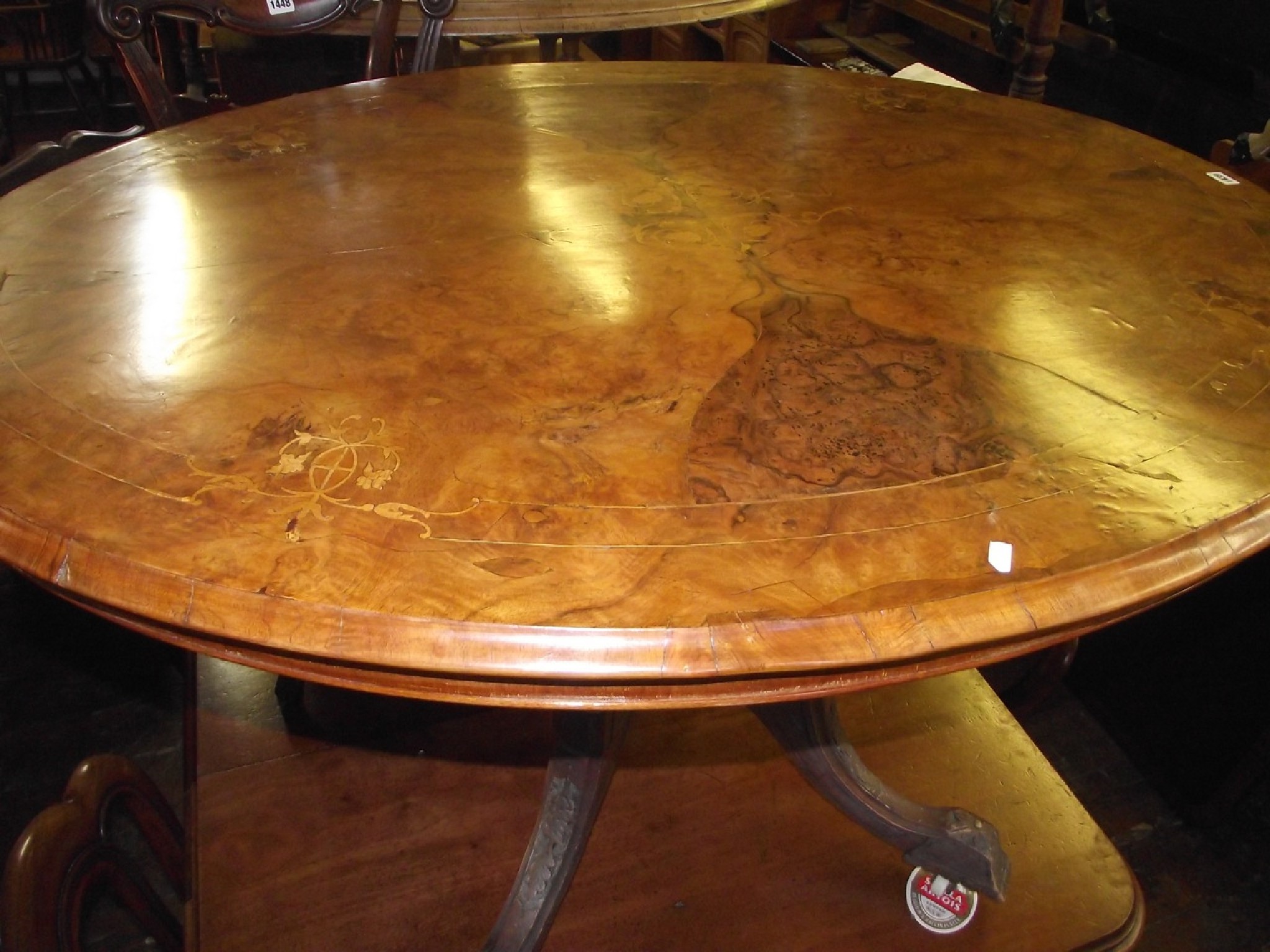 Appraisal: A mid Victorian walnut and figured walnut loo table the