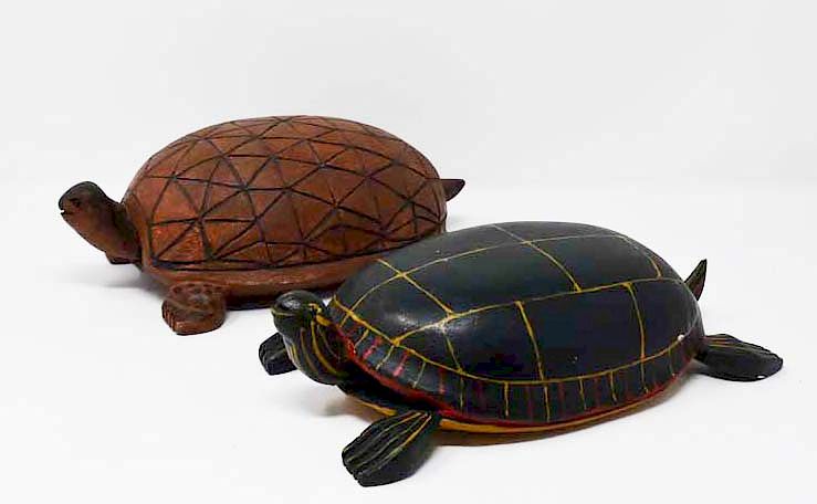 Appraisal: carved wooden turtles carved wooden turtles signed by Ed Hageman