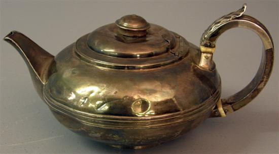 Appraisal: George III silver teapot of squat ovoid form with central