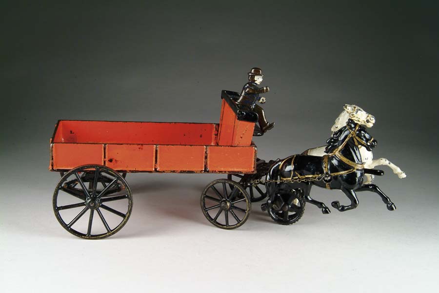 Appraisal: RED HORSE-DRAWN WAGON BY CARPENTER Cast iron wagon enameled red