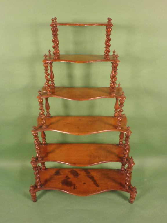 Appraisal: A Victorian maple six tier what not on spirally turned