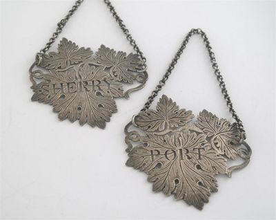 Appraisal: A pair of George IV engraved vine leaf wine labels