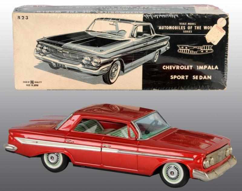 Appraisal: Tin Chevrolet Impala Sports Sedan Friction Toy Description Japanese Circa