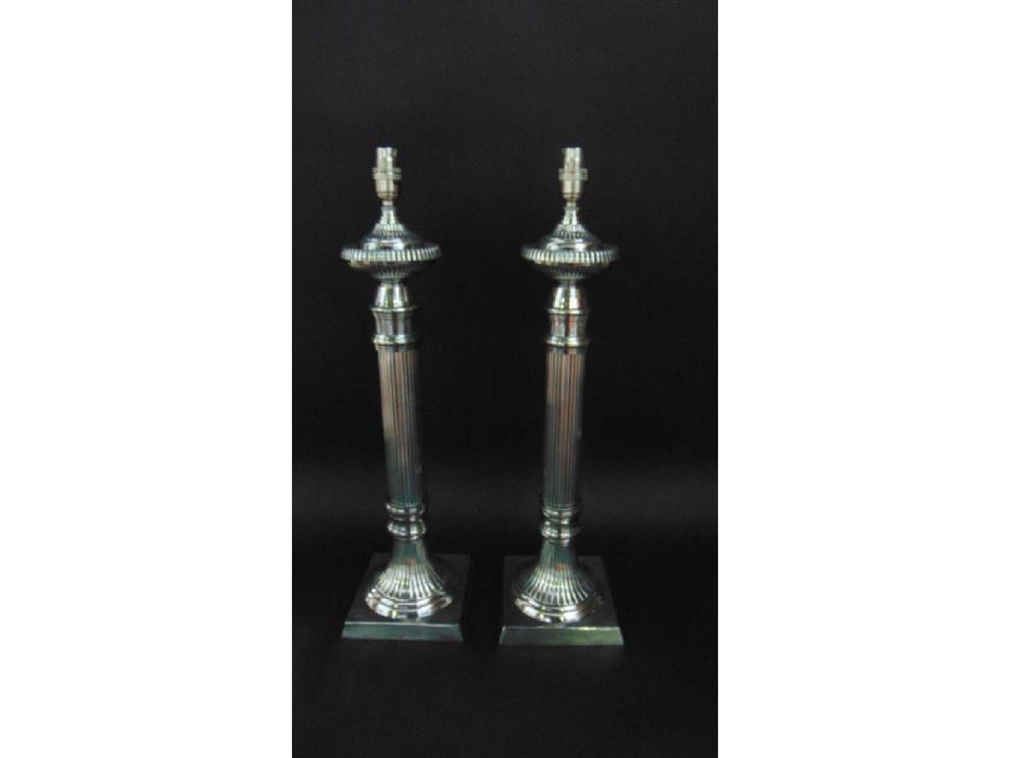 Appraisal: A tall pair of contemporary silver plated table lamps in