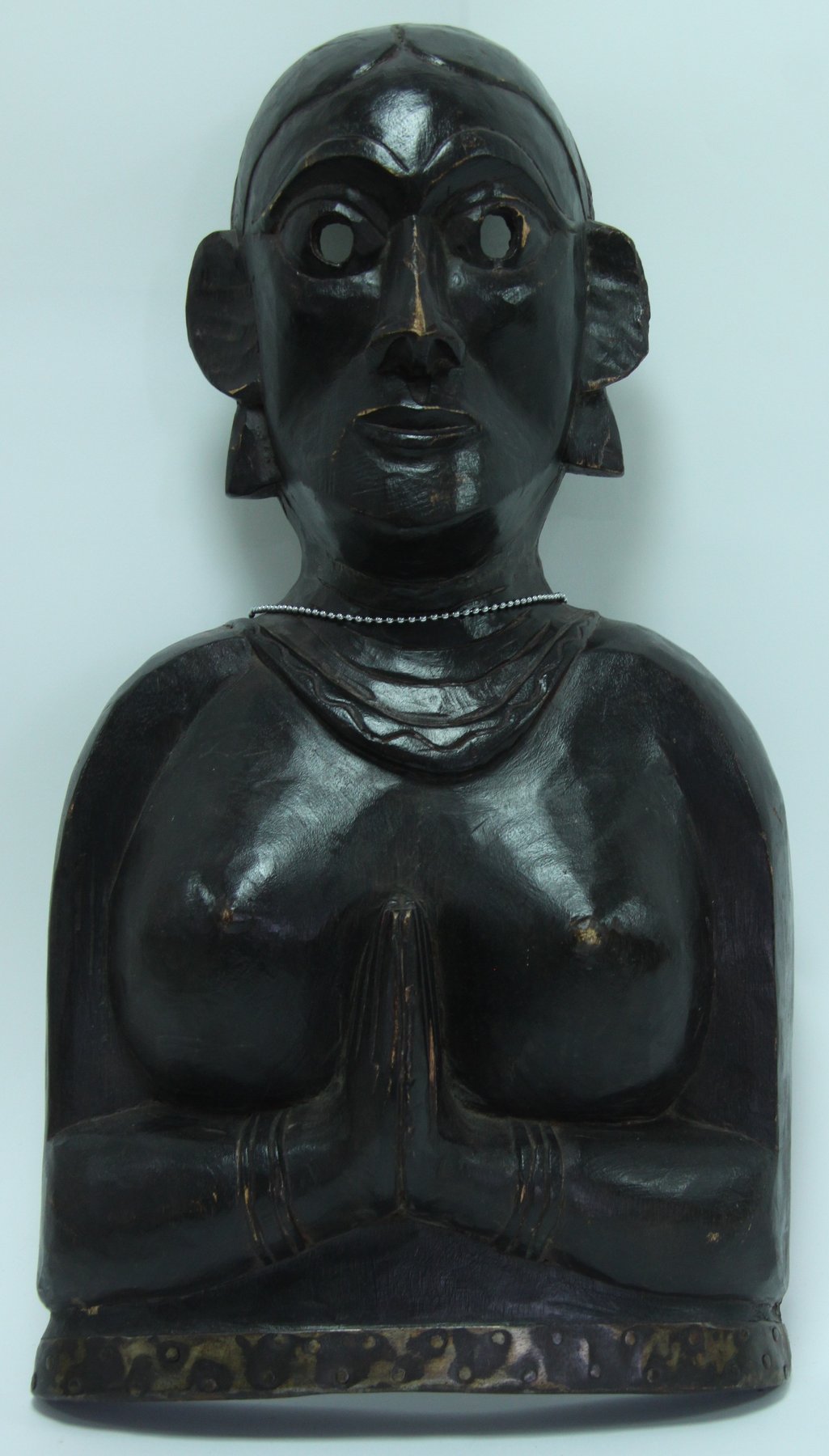 Appraisal: A carved tribal mask female figure at prayer