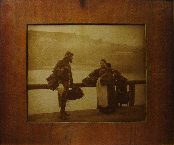 Appraisal: Victorian photographic sepia print of a fisherman on a wharf