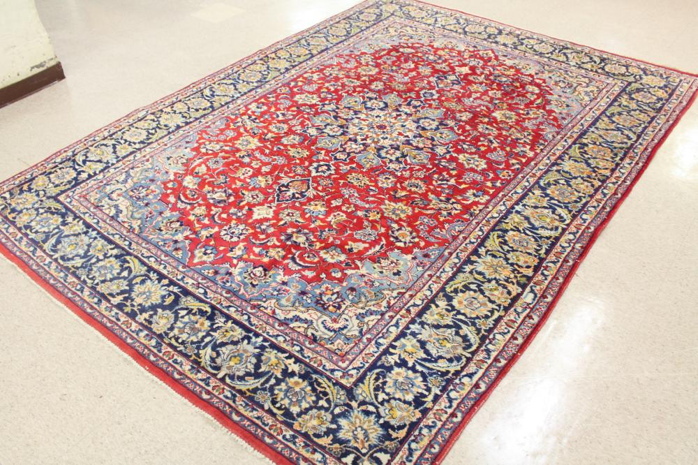 Appraisal: HAND KNOTTED PERSIAN CARPET floral and central floral medallion design