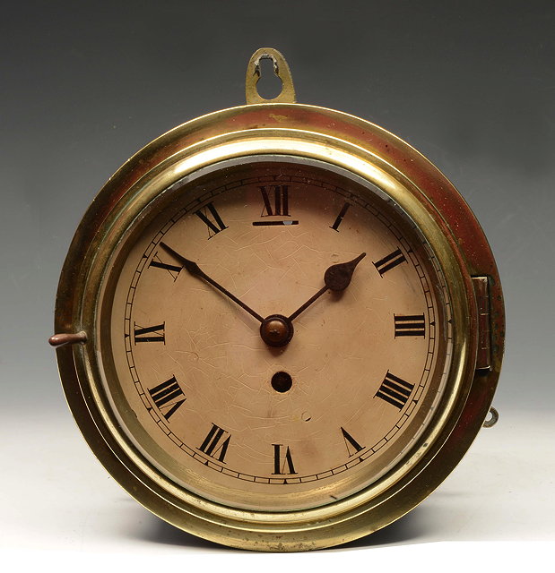 Appraisal: AN OLD SHIPS BULKHEAD TIMEPIECE with Roman dial and brass