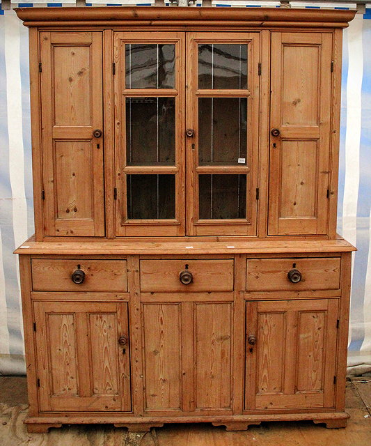 Appraisal: A TH CENTURY PINE DRESSER with two panelled cupboard doors