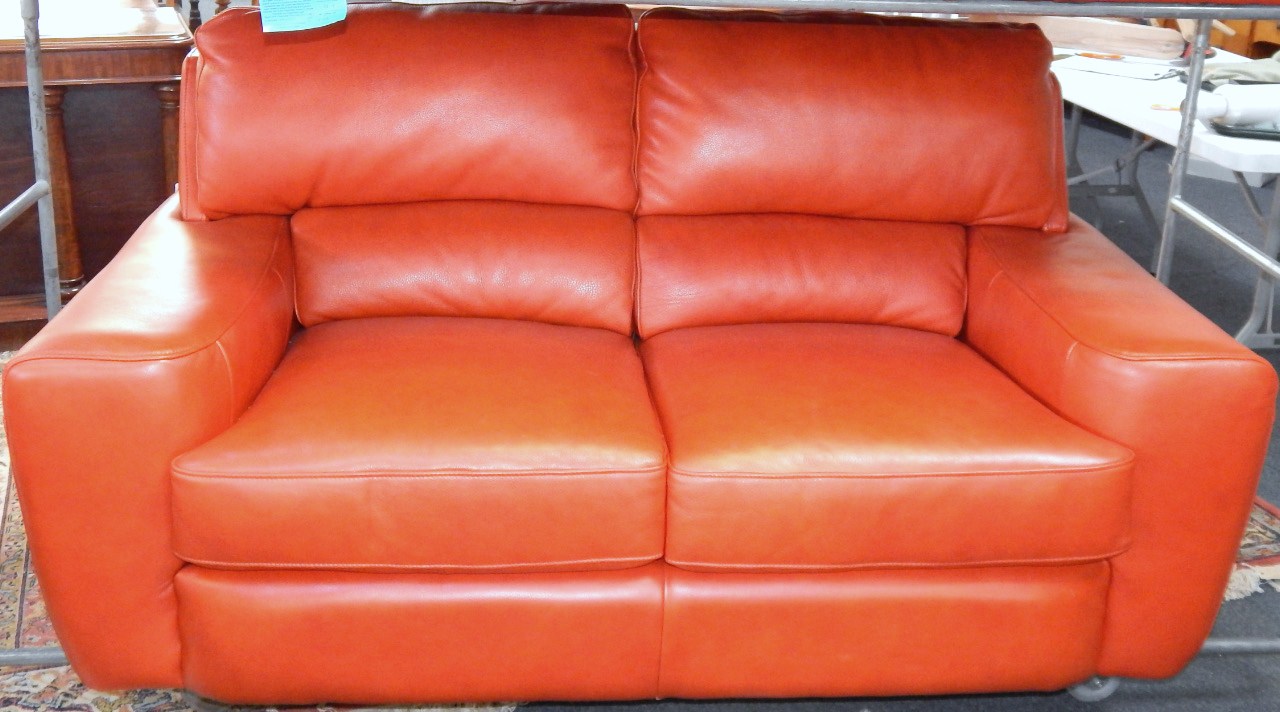 Appraisal: A red hide three seater sofa cm long cm deep