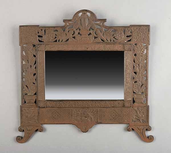 Appraisal: An Aesthetic Cast Iron Framed Mirror having an owl fox