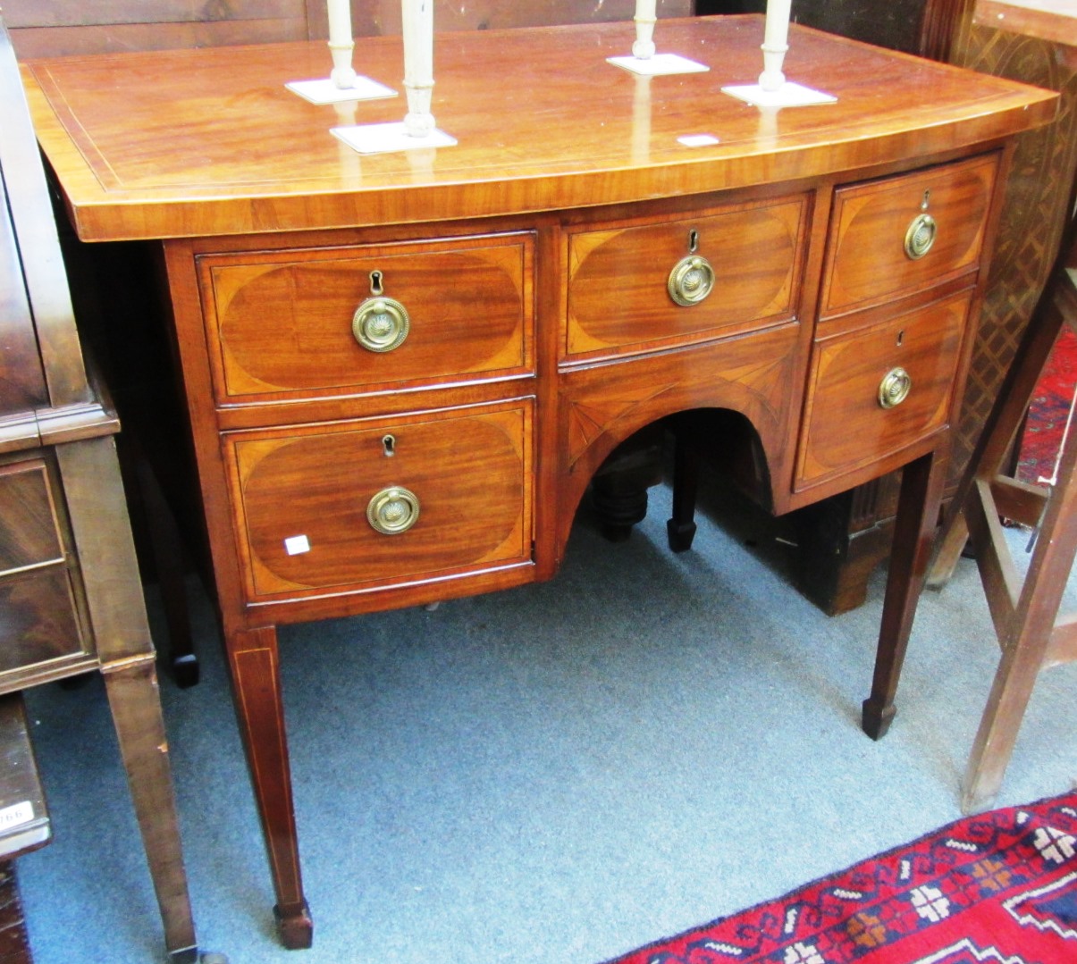 Appraisal: A George III mahogany and satinwood crossbanded bowfront sideboard on