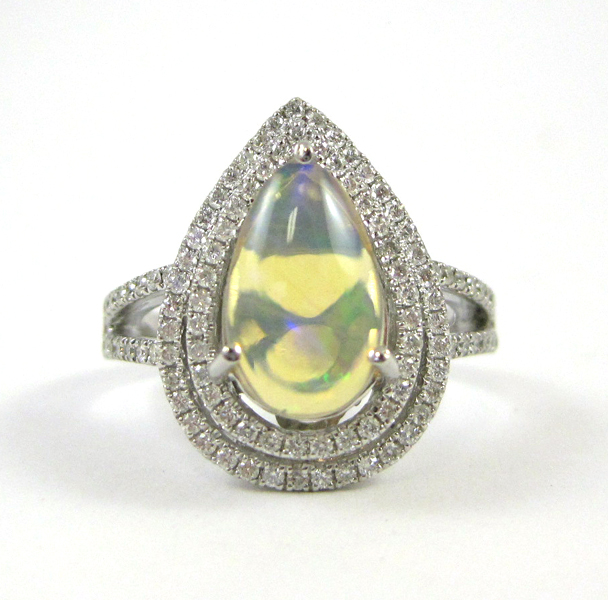 Appraisal: OPAL DIAMOND AND FOURTEEN KARAT WHITE GOLD RING with round-cut