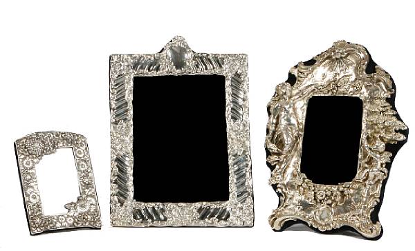 Appraisal: A group of three repousse sterling photograph frames height of