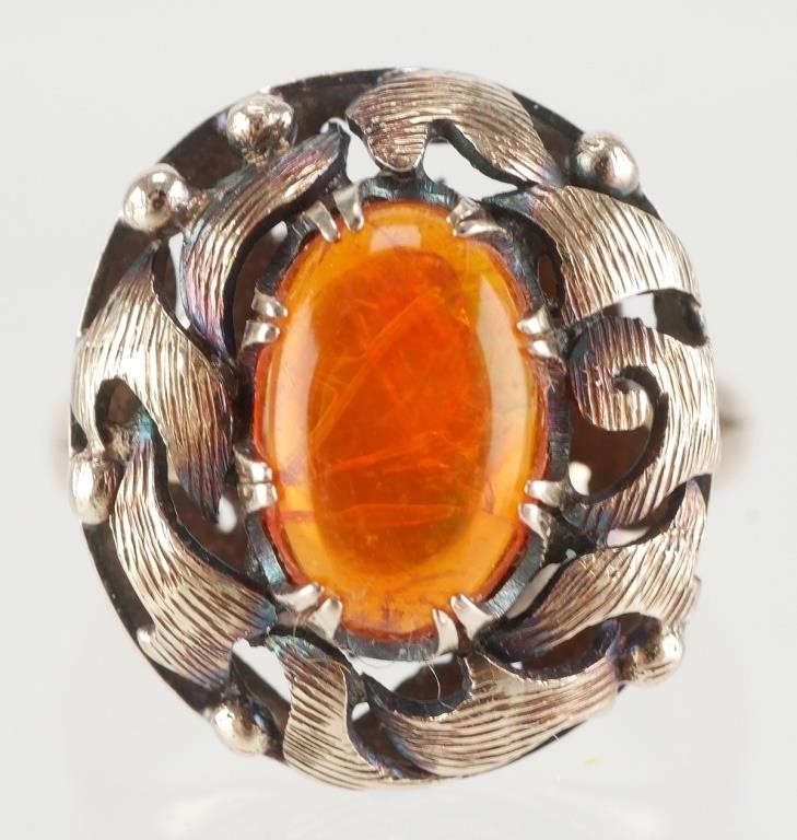 Appraisal: K gold and amber cabochon ring Stamped K on band