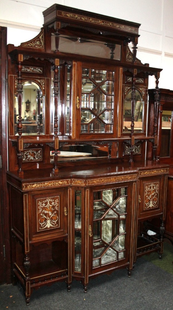 Appraisal: A thC mahogany rosewood and bone inlaid mirror back display