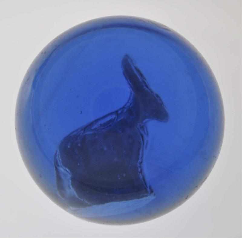 Appraisal: Donkey Sulphide Marble in Cobalt Blue Glass Description This is