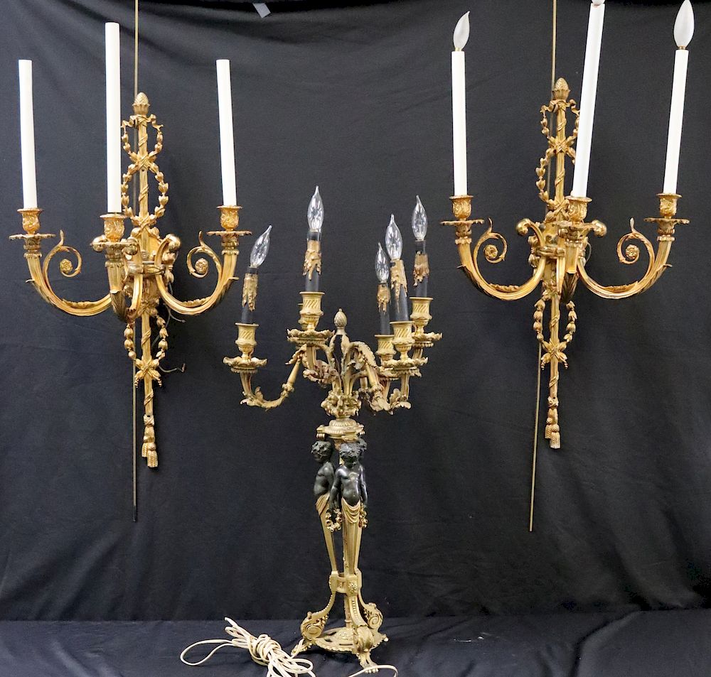 Appraisal: Antique Bronze Lighting Grouping To include sconces and a figural