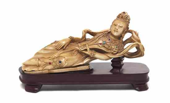 Appraisal: An Ivory Carving of a Reclining Deity of a female