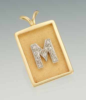 Appraisal: A Ladies' Diamond M Initial Pendant k yellow gold pendant