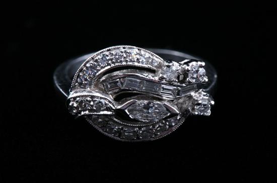 Appraisal: PLATINUM AND DIAMOND SCROLL DESIGN RING round and five tapering