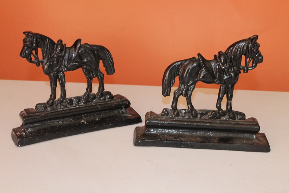 Appraisal: A pair of Victorian cast iron flat back horse ornaments