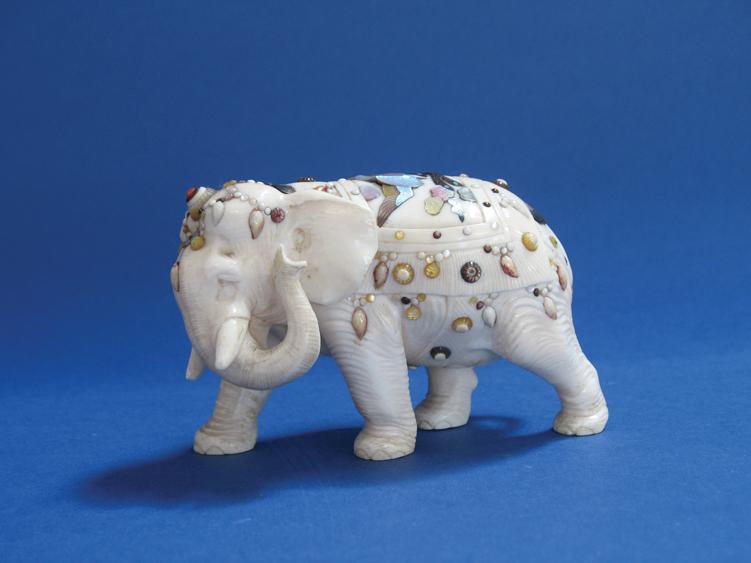 Appraisal: A JAPANESE IVORY AND SHIBYAMA ELEPHANT striding forward with trunk