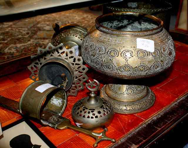 Appraisal: A SMALL COLLECTION OF INDO-PERSIAN BRASSWARE including a covered censer