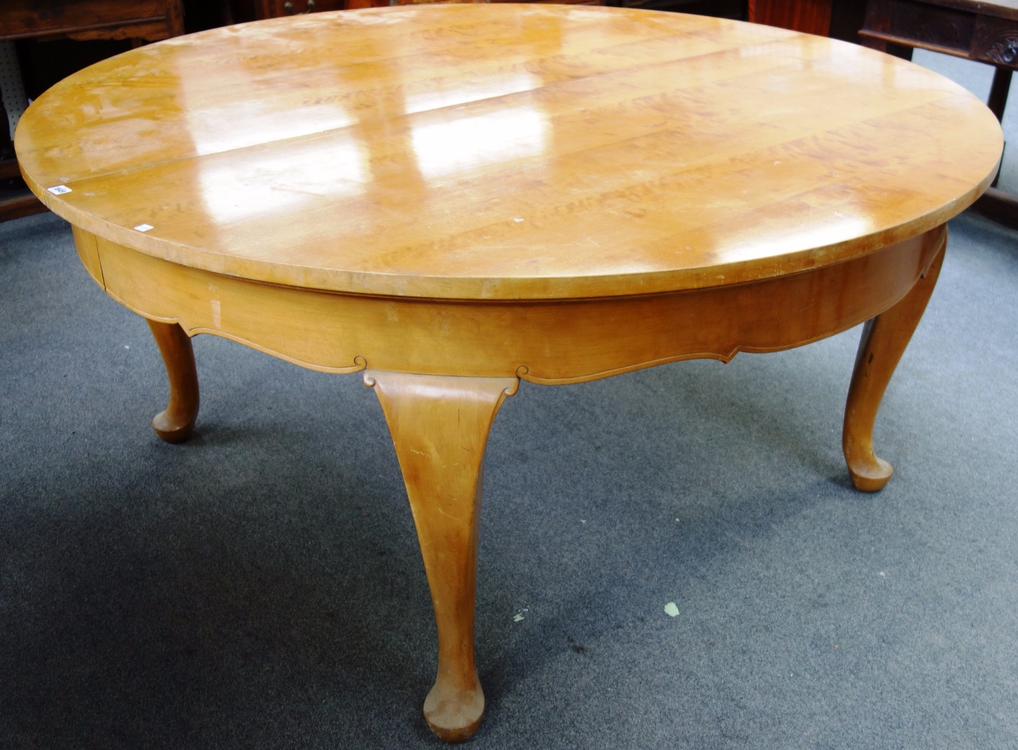 Appraisal: A th century French satin birch circular extending dining table