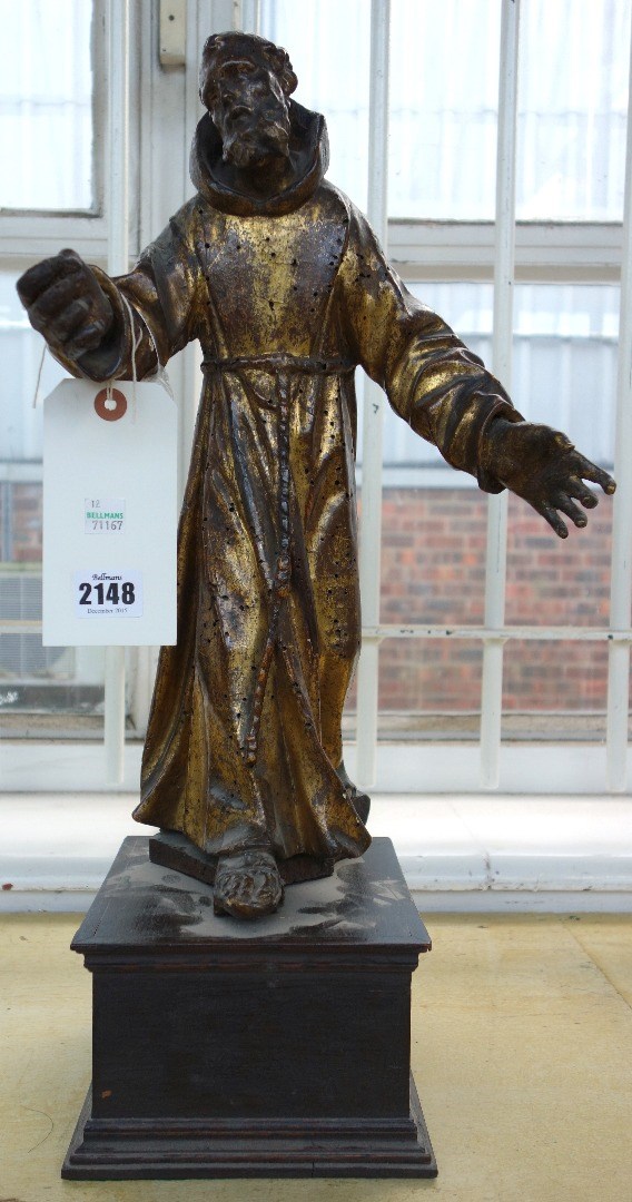 Appraisal: A th century style carved wooden figure depicting a robed