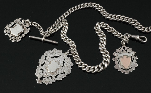 Appraisal: A STERLING SILVER ALBERT CHAIN WITH PENDANT MEDALLIONS The graduated