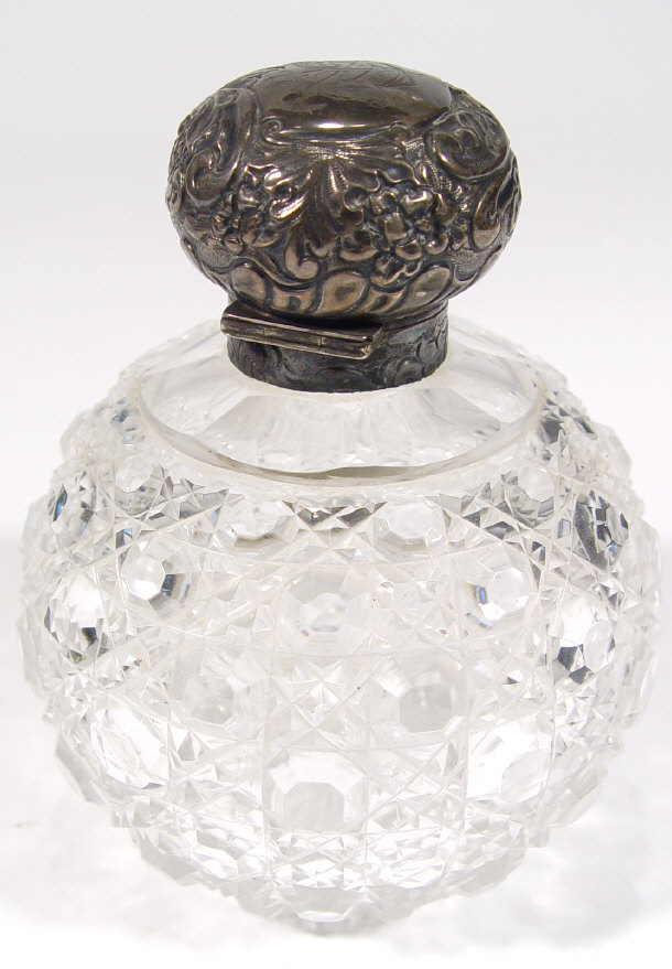 Appraisal: Globular cut glass scent bottle with hinged silver lid embossed