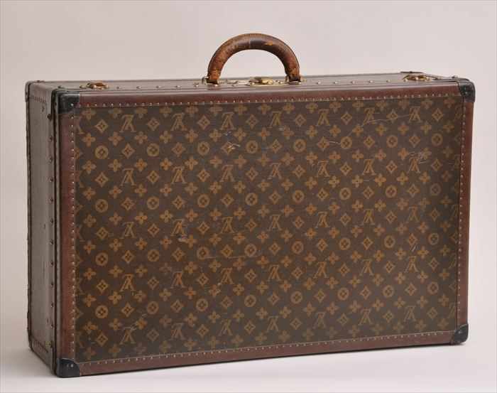 Appraisal: LOUIS VUITTON BRASS-MOUNTED LEATHER SUITCASE Lock No Case No with