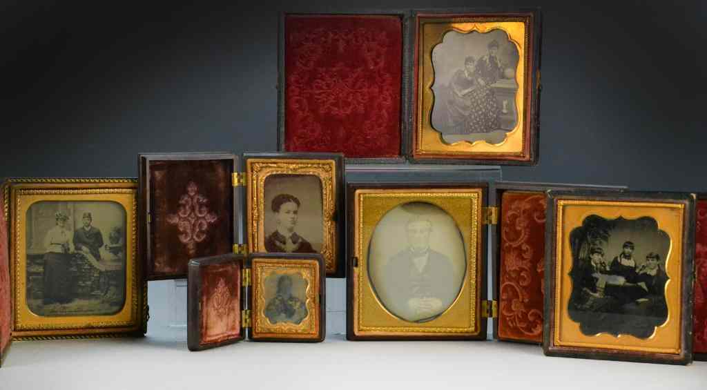 Appraisal: Tintypes Daguerrotypes in Gutta Percha FrameConsisitng of large and small