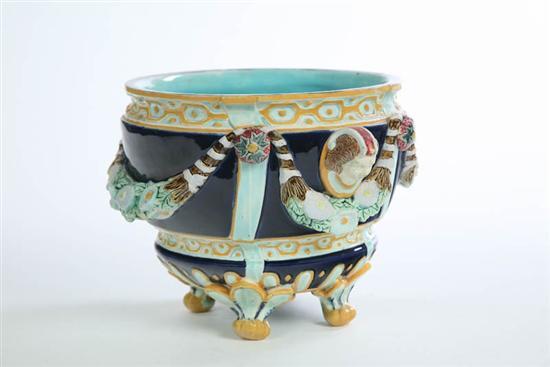 Appraisal: MAJOLICA JARDINIERE Possibly Holdcroft Footed jardiniere with floral swags on