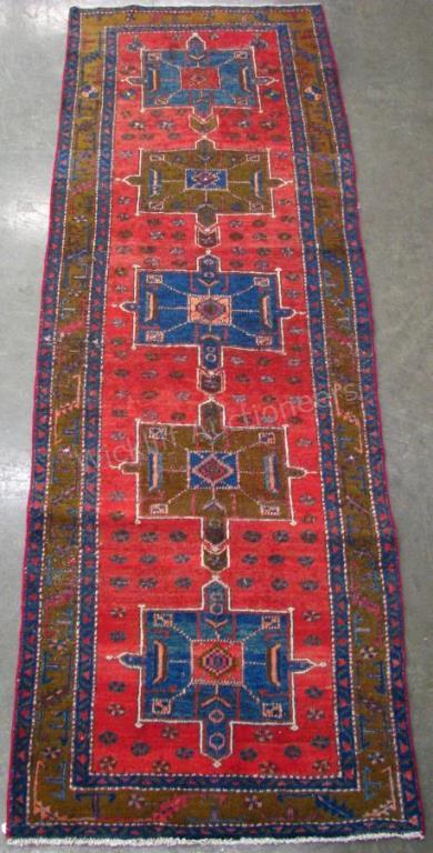 Appraisal: Handmade Oriental Runner Rug Serapi design red field with blue