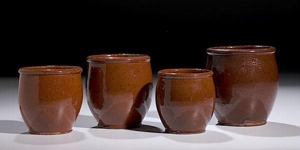 Appraisal: FOUR GRADUATED REDWARE STORAGE JARS possibly Pennsylvania ca - of