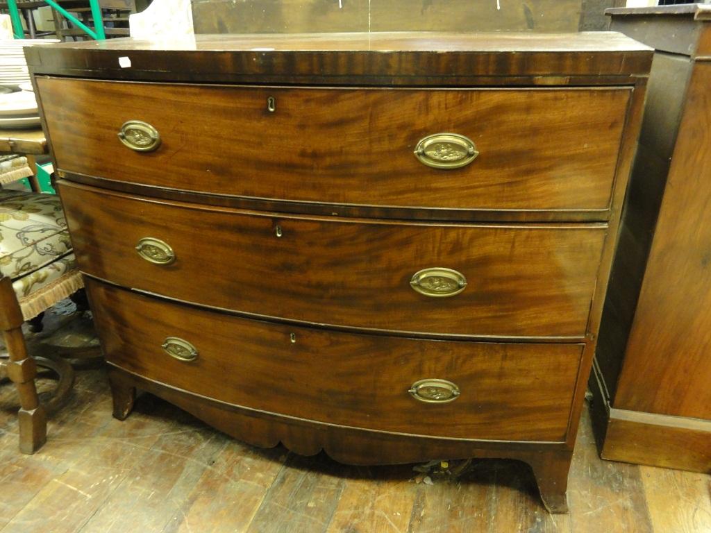 Appraisal: An early th century mahogany bow fronted chest fitted with