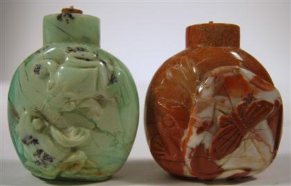 Appraisal: Pair of carved hardstone snuff bottlesComprising a green bottle carved